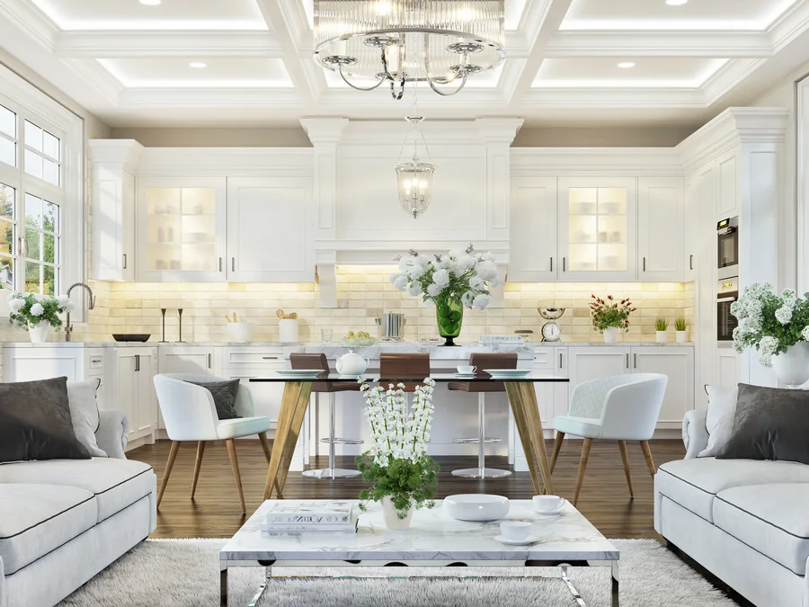 White open-plan kitchen, living and dining space with coffered ceilings and bay windows.